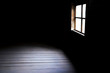 © Светлана Евграфова - Darkness and horror, background with copy space. Inside in an empty dark room of an old abandoned house with black walls mystical light in the darkness of the window with a spot on the floor