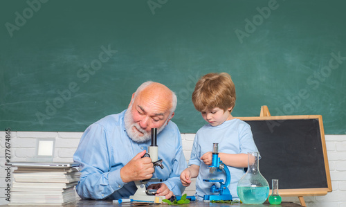 Friendly Teacher In Classroom Near Blackboard Desk Old Teacher