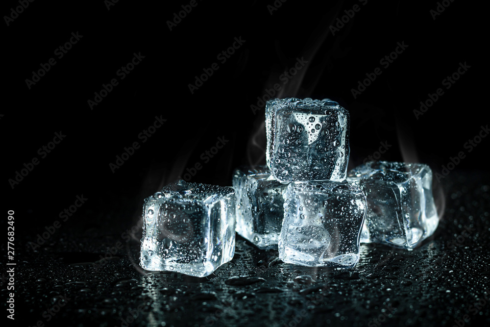 ice cubes and cooling smoke on dark table background. Ice blocks with cold drinks. - obrazy, fototapety, plakaty 