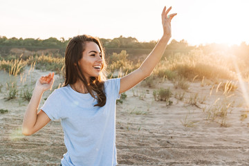 Poster - Beautiful young woman having a lovely time at the beach