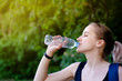 © Anana_go - Beautiful girl drinking water after exercise. Playing sport.