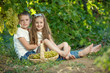 © nuzza11 - Child with grapes on nature.