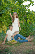 © nuzza11 - Child with grapes on nature.