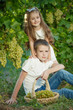 © nuzza11 - Child with grapes on nature.