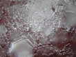 Аir bubbles in the water on a red background.