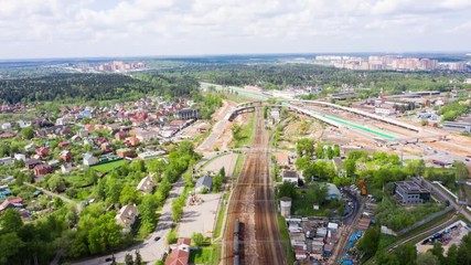 Wall Mural - timelapse road and rail traffic with construction of a new road junction over the railway in Moscow, Vnukovo.