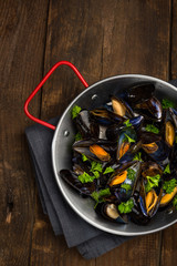 Wall Mural - Seafood Mussels in Pan, Top View on Wooden Background, Copy Space