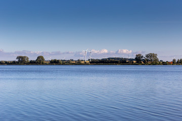 Wind turbines near a lake in Poland