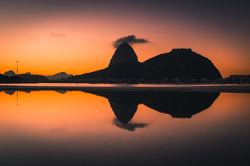 Wall Mural - View of the Sugarloaf Mountain Reflected on Water by Sunrise, in Rio de Janeiro, Brazil