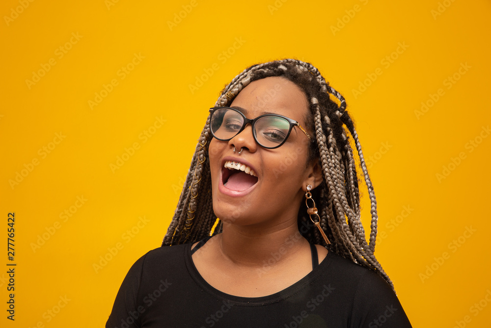 Beautiful young african american woman with dread hair and eyeglasses ...