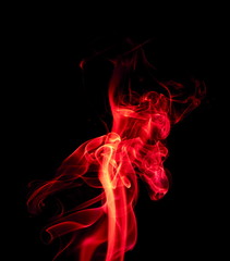 Red smoke on black background