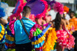 Abstract view of samba dancers in colorful frilled costumes at a daytime Carnival street party in Rio de Janeiro, Brazil