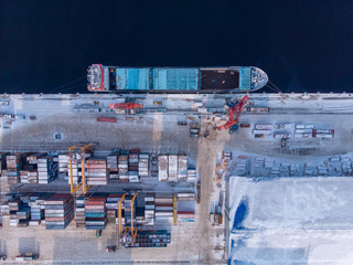 Wall Mural - Container cargo ship loading North Arctic port. Concept freight transportation import export and business logistic, aerial view winter