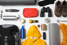 Flat Lay Composition With Different Camping Equipment On White Background