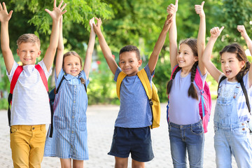 Sticker - Group of cute little pupils outdoors