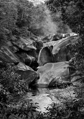 Wall Mural - Devil's Pool or Babinda Boulders is a mystical natural pool at the confluence of three streams among a group of boulders near Babinda, Queensland, Australia. Black and White photography. -Image. 