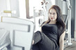 © Kencana Studio - asian woman working out at gym with cycle machine
