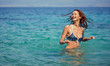 © ZoomTeam - Bikini girl on the beach. Young beautiful woman in bikini on the beach on Adriatic Sea