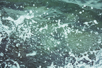 Water texture background with splash and drops.