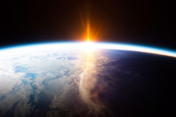 Wall Mural - earth planet and sunrise view from space - element of this image provided by nasa