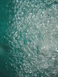 Small air bubbles in the water. Underwater background. Aquamarine bubbles. Water splash. Turquoise bubbles. Aquamarine water.  Turquoise water. 