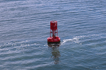 Red buoy in river