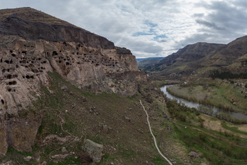 Top view of the cave city of Vardzia on the banks of the river Kura