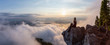 © edb3_16 - Adventurous Female Hiker on top of a mountain covered in clouds during a vibrant summer sunset. Taken on top of St Mark's Summit, West Vancouver, British Columbia, Canada.