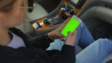 Close Up Stylish Woman Hands Use Smartphone In Business Car On Parking Green Screen Chroma Scroll Social Media 5g