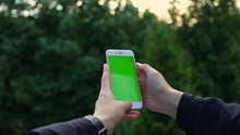 Woman Hands Use Smartphone On Nature Green Screen Chroma Scroll Social Media Shopping 5g