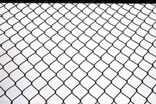 Texture The Cage Metal Net Isolate On White Background. Fence With Barbed Wire