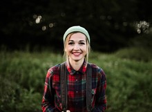 Young Beautiful Hipster Woman Standing On Field In The Countrysi