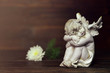 © izzzy71 - Sympathy card with angel and white flower on dark background