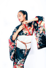Young Pretty Real Geisha In Kimono With Sakura And Decoration On White Background Isolated