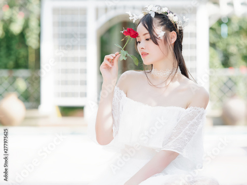 Beautiful Fairy Lady In White Wedding Dress And Garlands Of