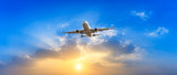 Airplane in the sky at sunrise