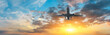 © ABCDstock - Airplane in the sky at sunrise