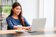 © chayathon2000 - Asian business girl working and drinking coffee in cafe