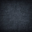 © prapann - Dark grey black slate background or texture.
