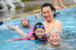 © nuiiko - Asian father teaching his daughter to swim, lifestyle concept.