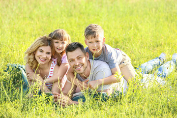 Happy family in park on summer day