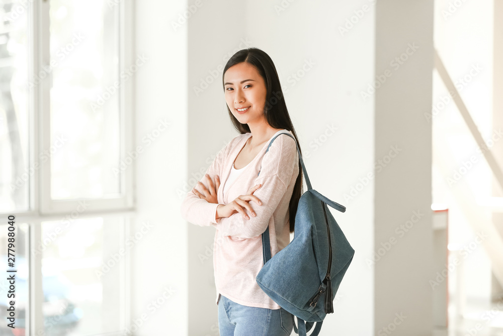 Young Asian student in university