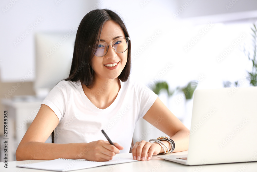 Young Asian student preparing for exam in university