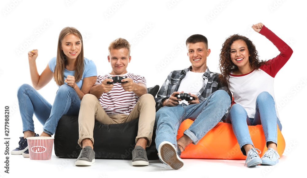 Teenagers playing video game on white background