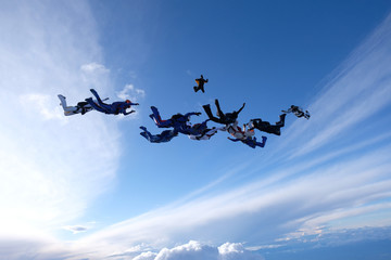 A group of skydivers is in the sky.