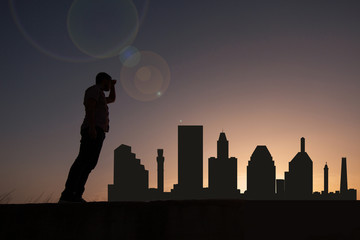 Poster - Traveler facing the skyline of the city of Baltimore in the United States