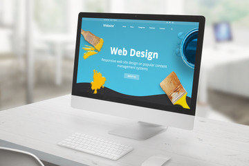 Leinwandbilder - Web design studio concept with computer display on office desk and modern, flat web design studio presentation on screen with brushes and color drops.