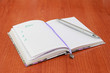 © Mari - Notebook for business and notes with white pages and pencil, penster