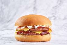 Double Cutlet Burger With Double Cheese And Bacon Isolated At White Marble Background.