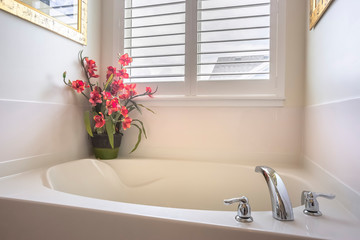 Wall Mural - Home bathroom with a bathtub installed in front of the window with blinds